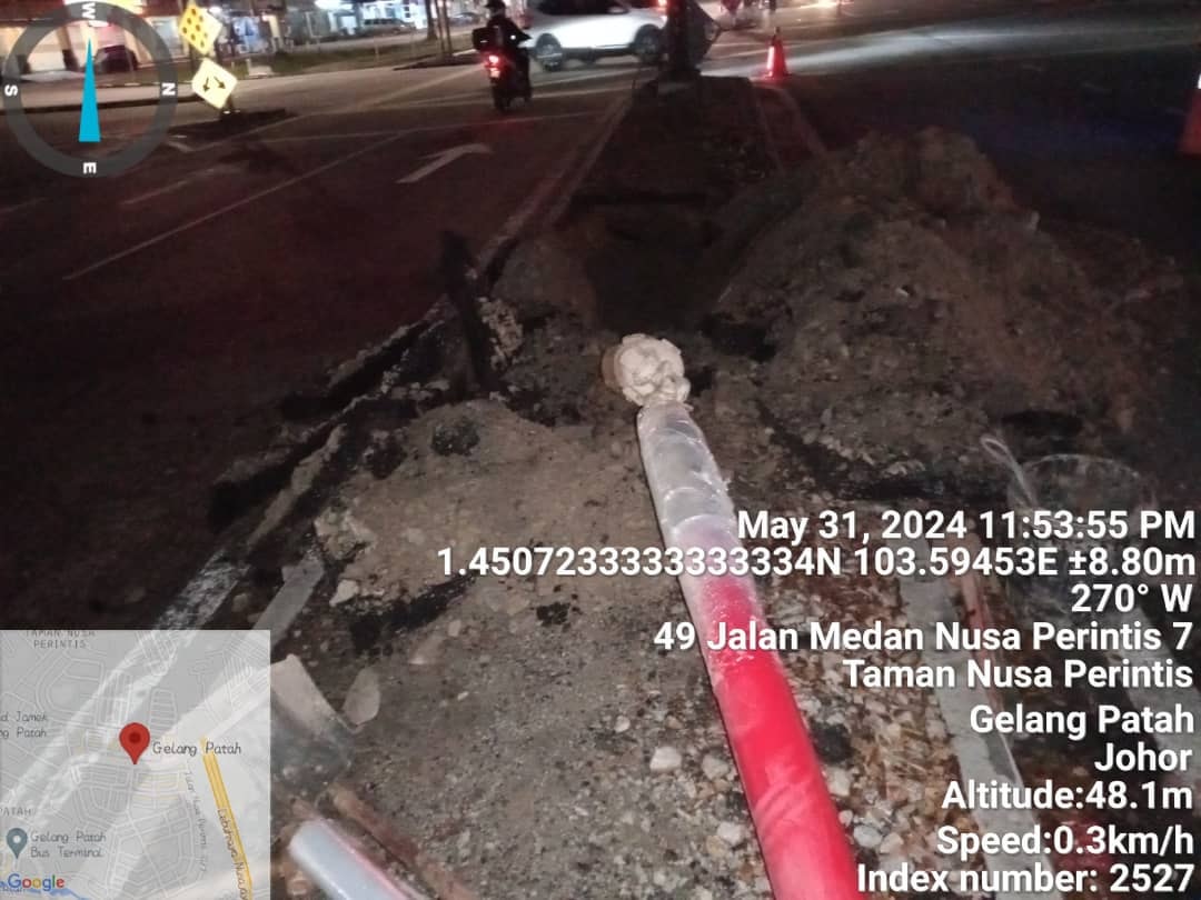 Red duct emerging from night trench at Jalan Medan Nusa Perintis 7, Taman Nusa Perintis, Gelang Patah (31 May 2024, 11:53 PM).